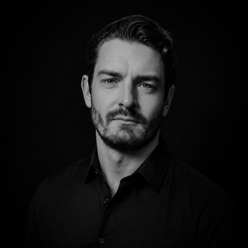 Daniel James, co-founder of Centrepoint, black and white portrait.